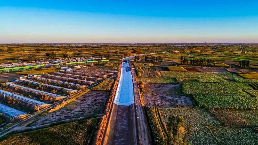 Aerial view of grouted mattress canal lining at sunset