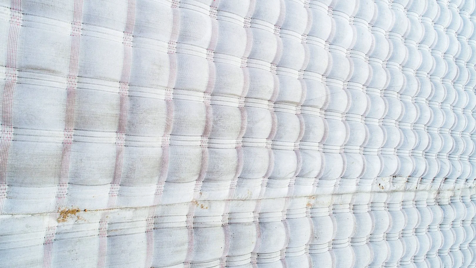 Aerial view of grouted mattress surface — uniform concrete armour requiring minimal long-term maintenance
