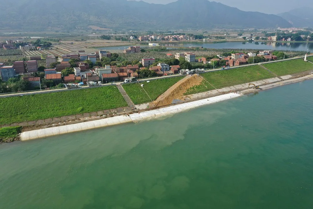 Aerial view of village coastal protection with grouted mattress