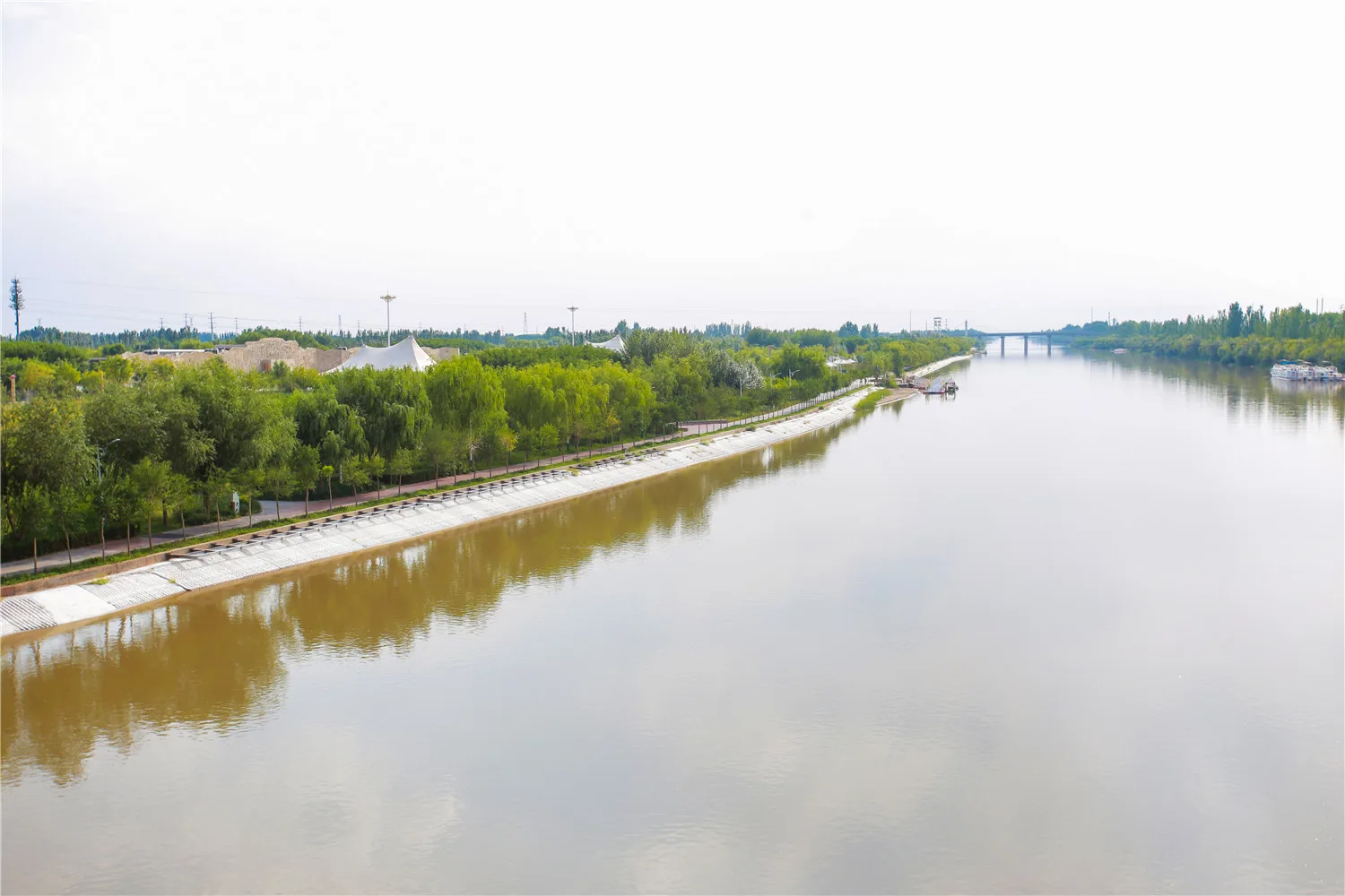 Wide view of urban river protected with grouted mattress
